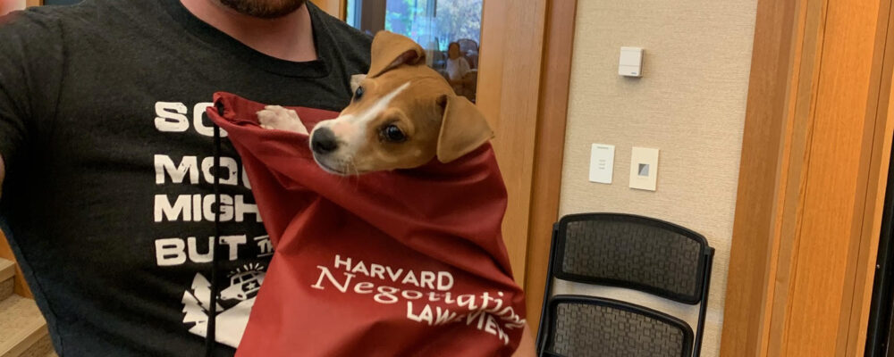 Man holding a small dog
